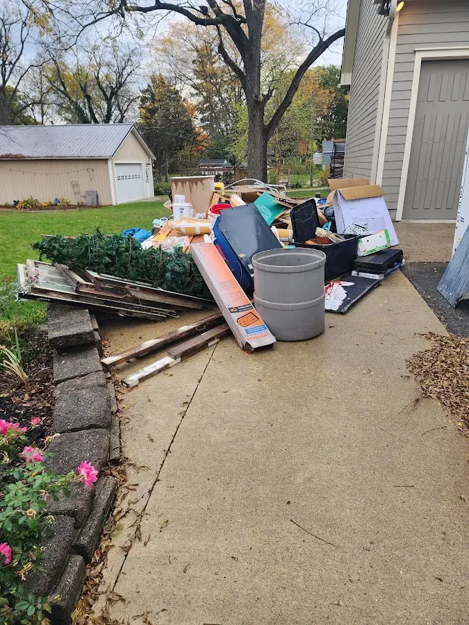 Dumpster being loaded with debris for Demolition Dumpster Rental in Dillon